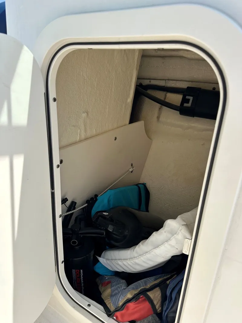 Slide: The Image of Storage compartment inside a boat with equipment and accessories. - 24