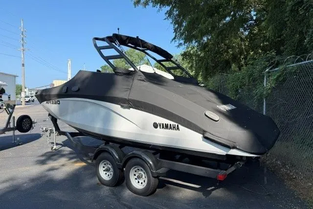 Slide: The Image of 2023 Yamaha Boats AR220 on trailer, covered and parked outdoors. - 15