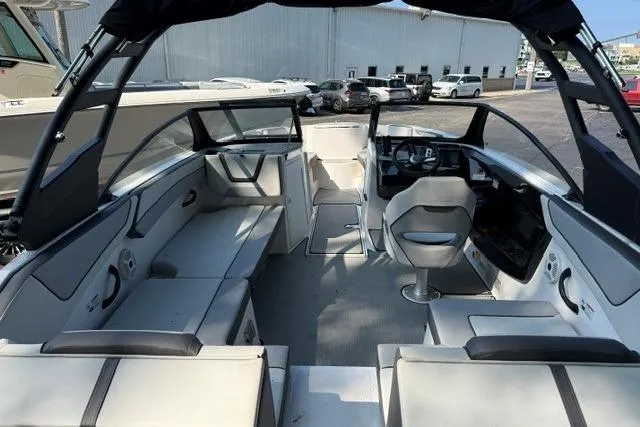 Slide: The Image of 2023 Yamaha Boats AR220 interior with sleek seating and modern dashboard design. - 5