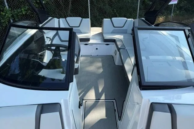 Slide: The Image of 2023 Yamaha Boats AR220 interior with sleek seating and modern design. - 9