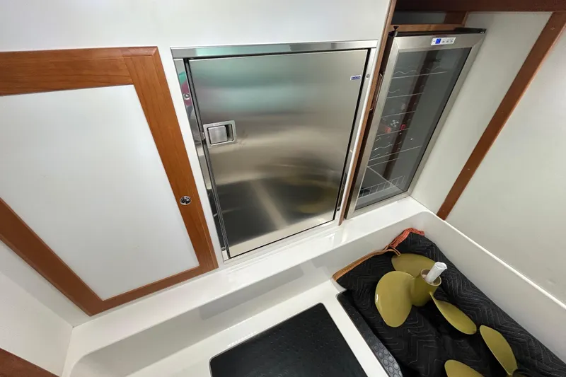 Slide: The Image of Interior of 2022 Sabre 45 Salon Express with stainless steel appliances and propeller. - 34