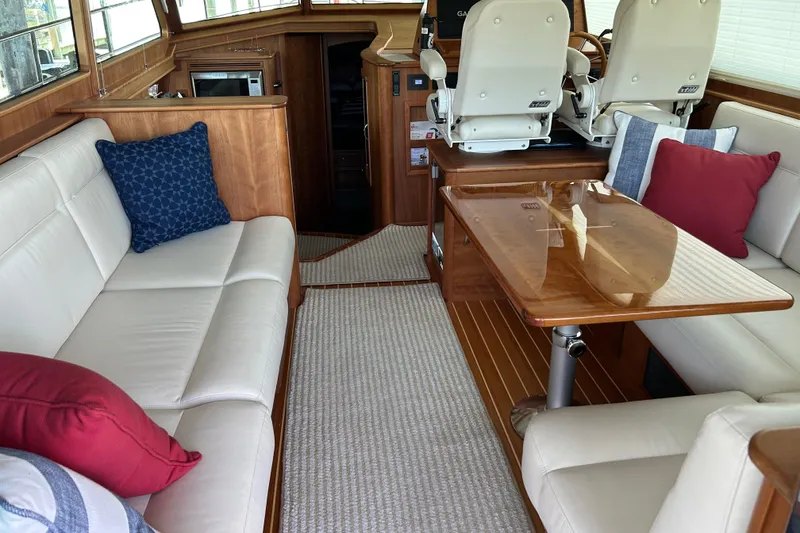 Slide: The Image of Luxurious interior of 2022 Sabre 45 Salon Express yacht with elegant seating and wooden table. - 13