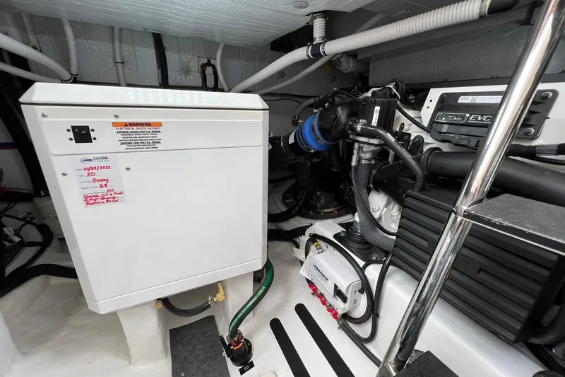 Slide: The Image of Engine room of 2022 Sabre 45 Salon Express, showcasing electrical and mechanical components. - 48