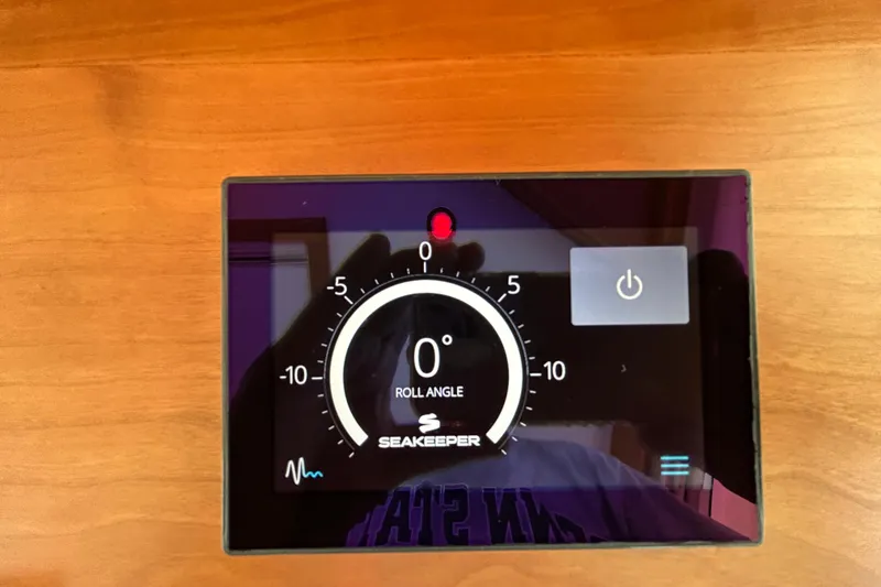 Slide: The Image of Seakeeper control panel on 2022 Sabre 45 Salon Express, displaying roll angle at zero degrees. - 22