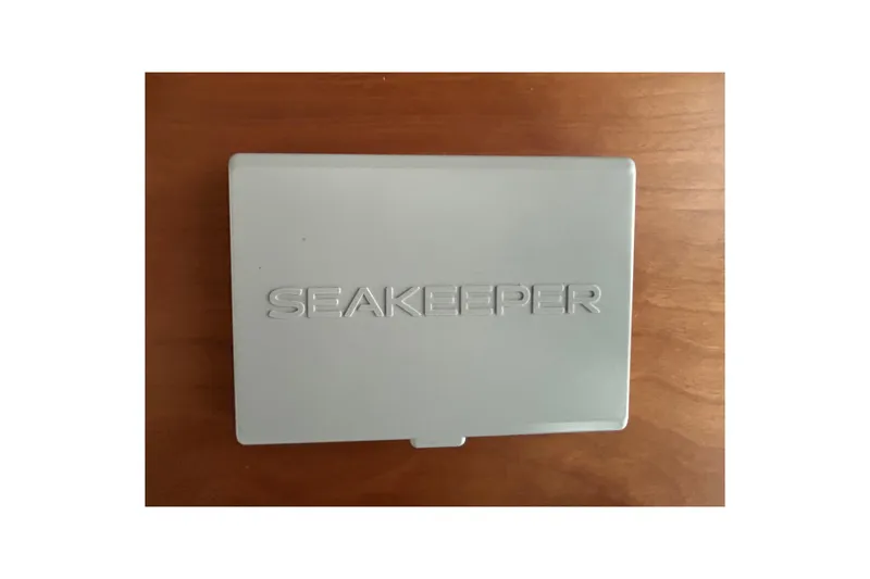 Slide: The Image of Seakeeper control panel on Sabre 45 Salon Express 2022 yacht, wooden background. - 21