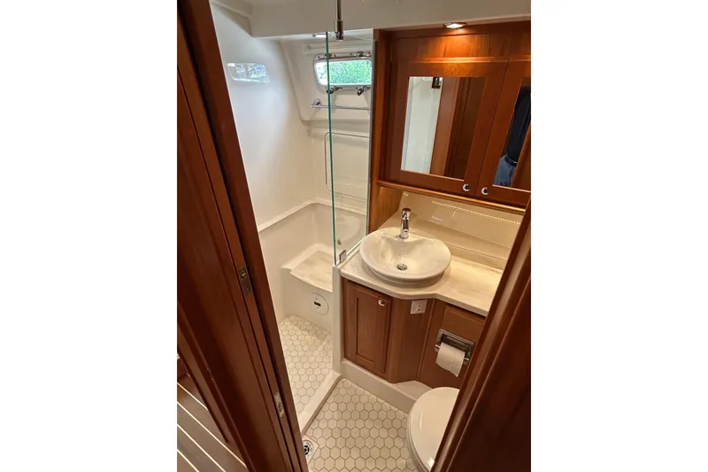 Slide: The Image of Luxurious bathroom in 2022 Sabre 45 Salon Express yacht with elegant wood cabinetry. - 58