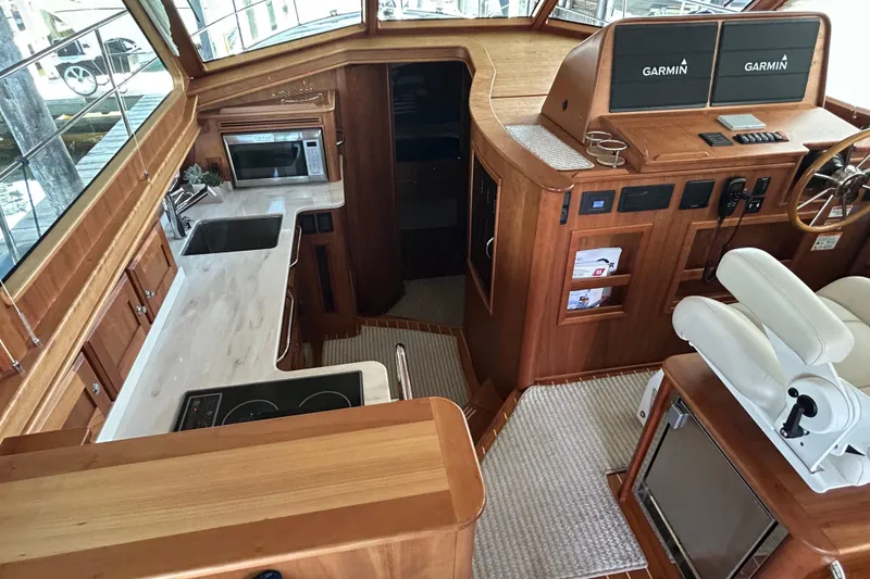 Slide: The Image of Interior of 2022 Sabre 45 Salon Express yacht with modern kitchen and navigation equipment. - 38