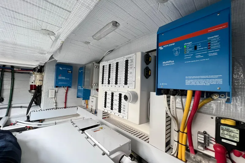 Slide: The Image of Electrical system of 2022 Sabre 45 Salon Express with inverters and control panels. - 49