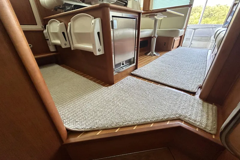 Slide: The Image of Interior of 2022 Sabre 45 Salon Express yacht with carpeted flooring and seating area. - 37