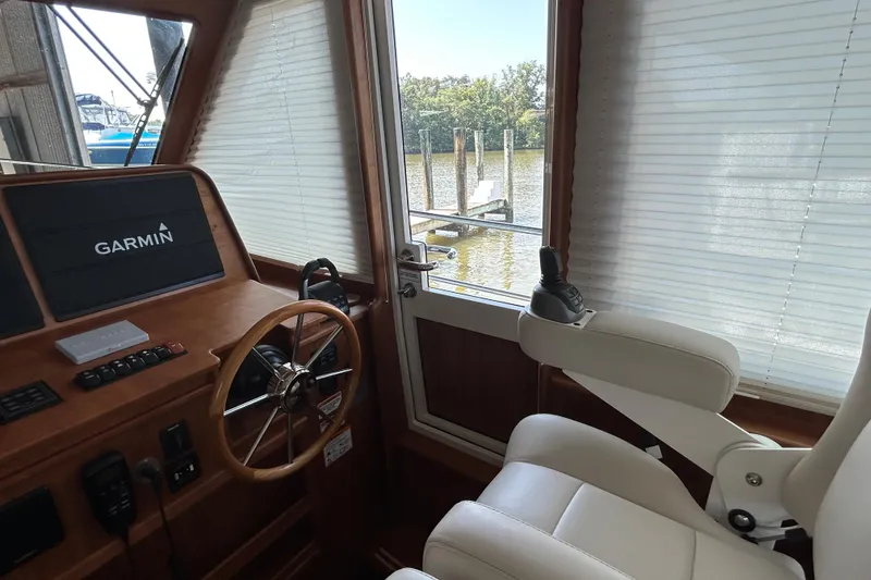 Slide: The Image of Interior helm of 2022 Sabre 45 Salon Express with Garmin navigation system. - 25