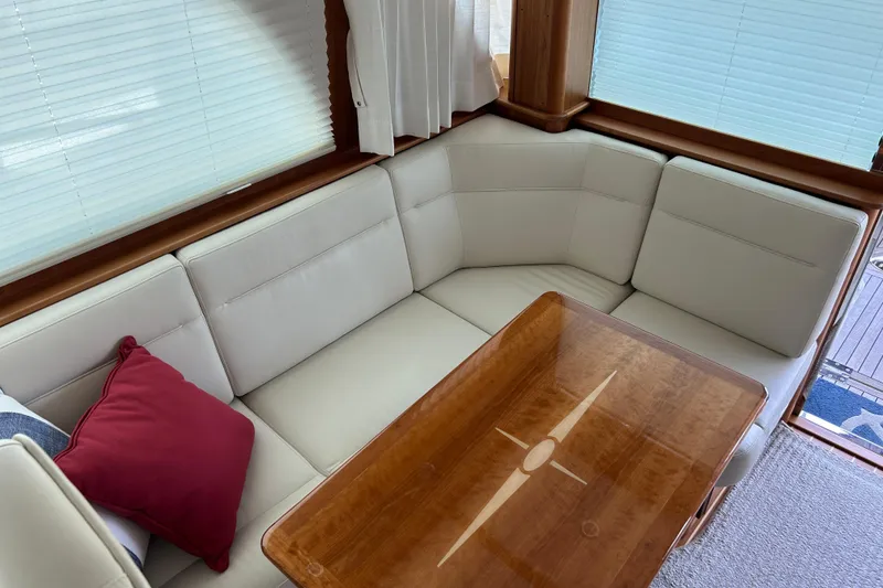 Slide: The Image of Luxurious interior of 2022 Sabre 45 Salon Express with elegant seating and wooden table. - 15