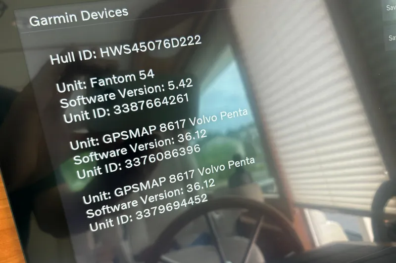 Slide: The Image of Garmin device display on 2022 Sabre 45 Salon Express, showing software versions and unit IDs. - 20