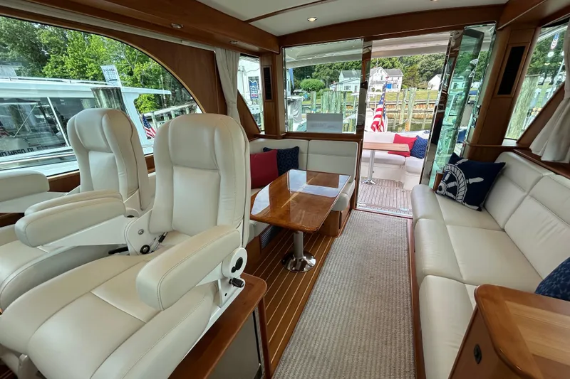 Slide: The Image of Luxurious interior of 2022 Sabre 45 Salon Express yacht with plush seating and elegant wood finishes. - 15