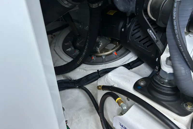 Slide: The Image of Engine compartment of 2022 Sabre 45 Salon Express with visible hoses and components. - 45