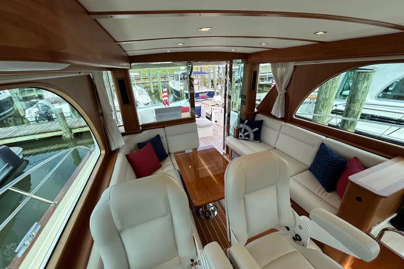 Slide: The Image of Interior of 2022 Sabre 45 Salon Express yacht with elegant seating and wooden accents. - 28