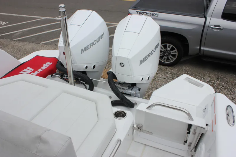 Slide: The Image of 2027 Wellcraft 28 T-Top boat with dual Mercury outboard engines. - 15