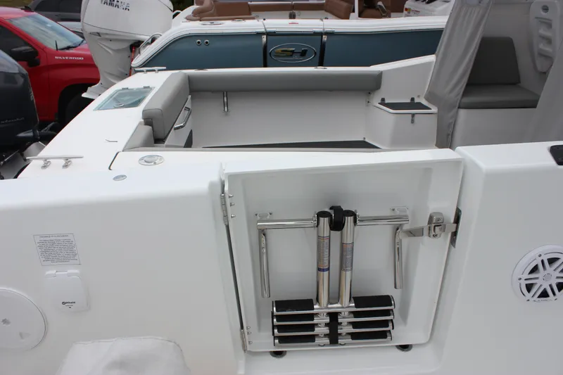 Slide: The Image of 2027 Wellcraft 28 T-Top boat interior with storage compartment and seating area. - 19
