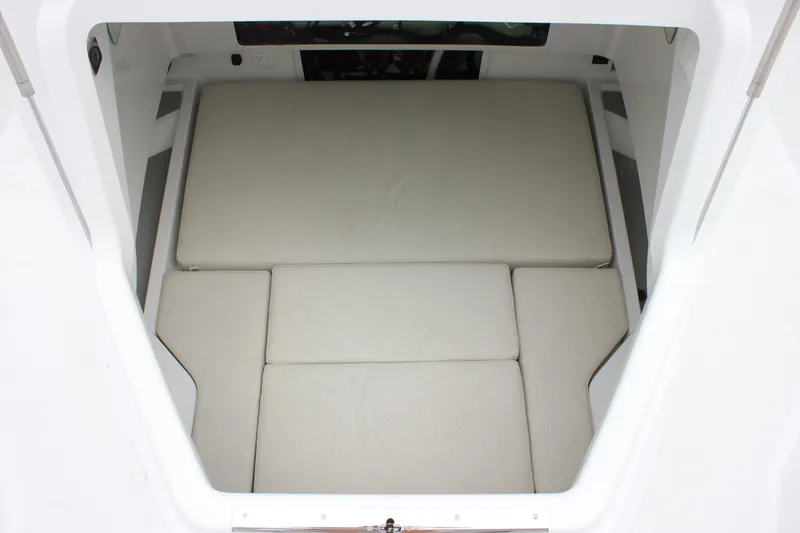 Slide: The Image of Interior cabin view of 2027 Wellcraft 28 T-Top boat with cushioned seating. - 62