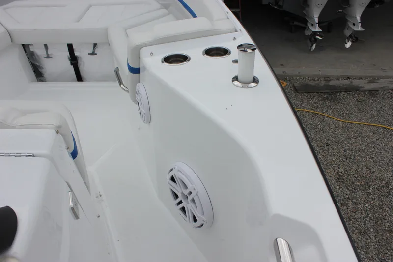 Slide: The Image of Interior view of 2027 Wellcraft 28 T-Top boat, featuring seating and cup holders. - 53