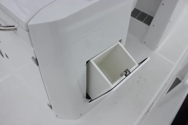 Slide: The Image of Storage compartment on 2027 Wellcraft 28 T-Top boat, featuring sleek white design. - 24