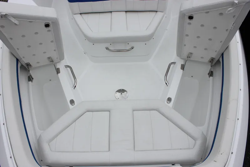 Slide: The Image of Interior view of 2027 Wellcraft 28 T-Top boat with open storage compartments. - 45