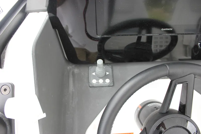 Slide: The Image of Steering console of 2027 Wellcraft 28 T-Top boat with Garmin display and joystick control. - 29