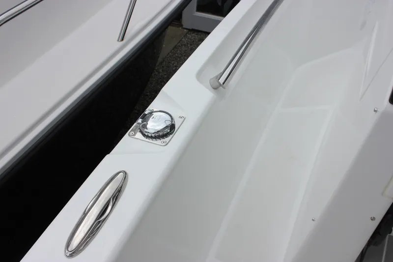Slide: The Image of 2027 Wellcraft 28 T-Top boat deck with stainless steel fittings and fuel cap. - 38