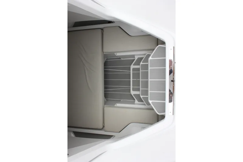 Slide: The Image of Interior cabin view of 2027 Wellcraft 28 T-Top boat, featuring cushioned seating. - 61