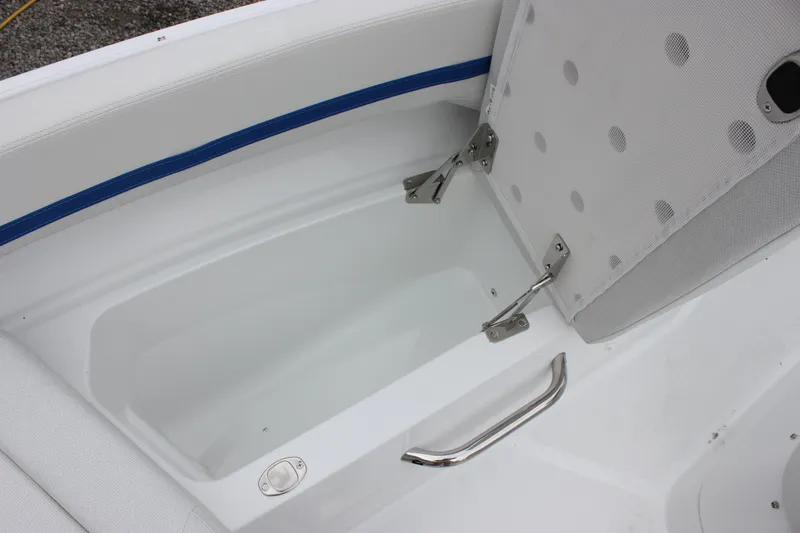 Slide: The Image of Storage compartment in 2027 Wellcraft 28 T-Top boat with cushioned seating and stainless steel handle. - 46
