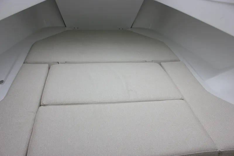 Slide: The Image of Interior cabin view of 2027 Wellcraft 28 T-Top boat with cushioned seating. - 63