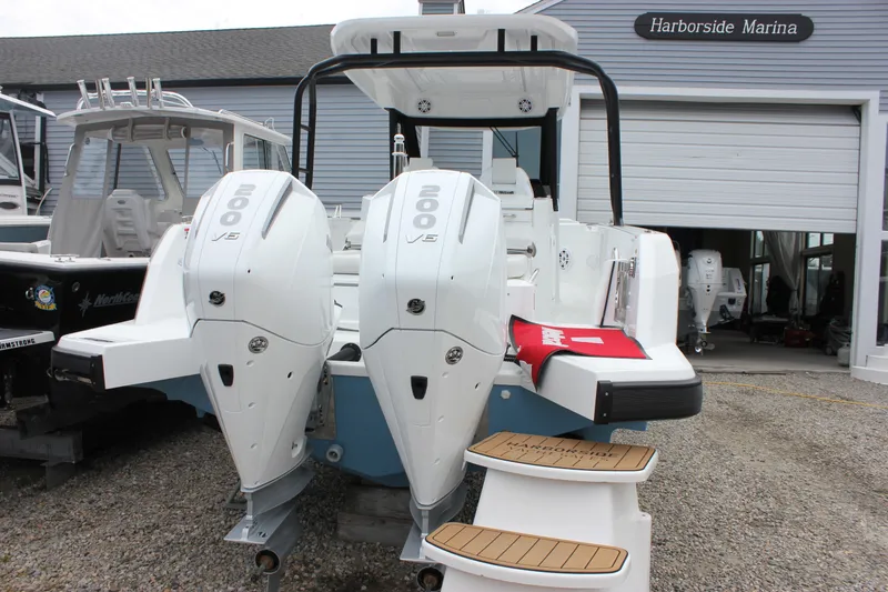Slide: The Image of 2027 Wellcraft 28 T-Top boat with twin 200 V6 engines at Harborside Marina. - 7