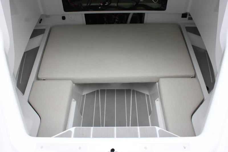 Slide: The Image of Interior cabin of 2027 Wellcraft 28 T-Top boat with cushioned seating. - 58