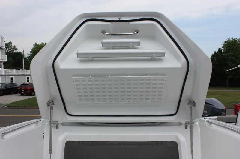 Slide: The Image of 2027 Wellcraft 28 T-Top boat storage compartment open, showcasing interior design. - 56