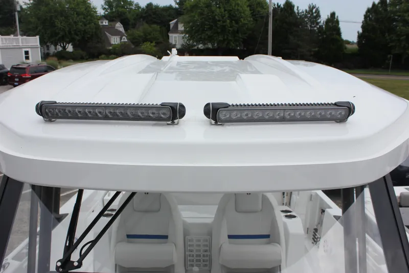 Slide: The Image of 2027 Wellcraft 28 T-Top boat with dual LED light bars on the roof. - 50