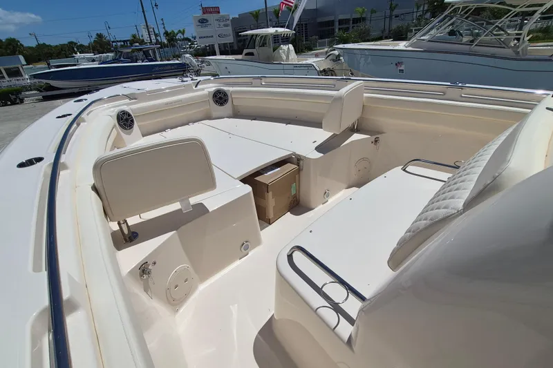 Slide: The Image of The image shows the cockpit of a Grady-White Canyon 336 boat with seating and storage. - 7