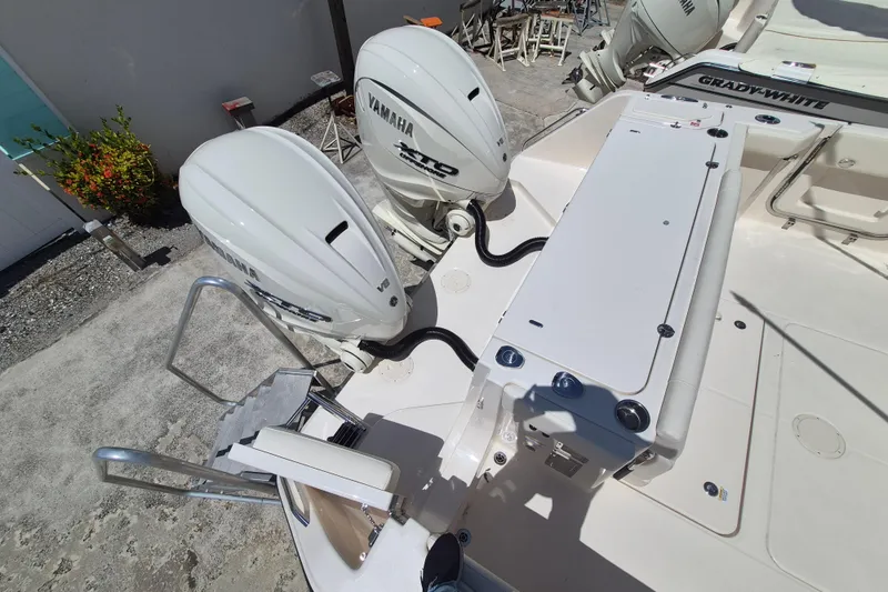 Slide: The Image of Two Yamaha outboard engines are mounted on the stern of a Grady-White Canyon 336 boat. - 24