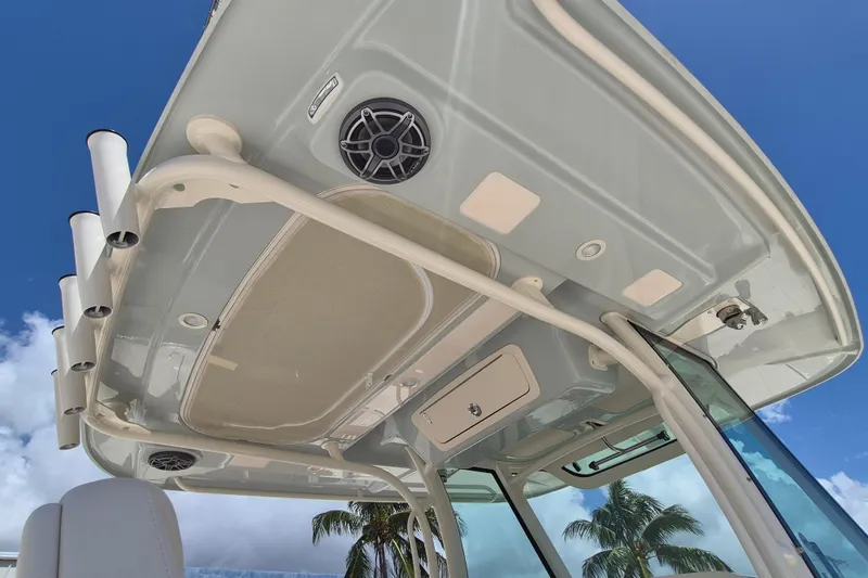 Slide: The Image of View of a Grady-White Canyon 336 boat's hardtop with speaker and rod holders. - 16