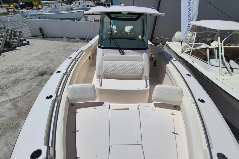 Slide: The Image of 2027 Grady-White Canyon 336 with spacious deck and seating area, ideal for fishing trips. - 9