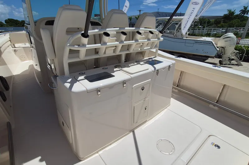 Slide: The Image of The image shows the cockpit of a Grady-White Canyon 336 boat with seating and storage. - 22