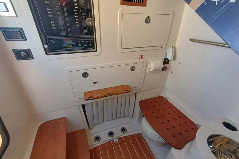 Slide: The Image of Interior of a Grady-White Canyon 336 with wood accents and control panel. - 17