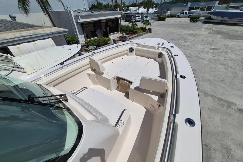 Slide: The Image of The image shows the bow deck of a Grady-White Canyon 336 boat with seating. - 8