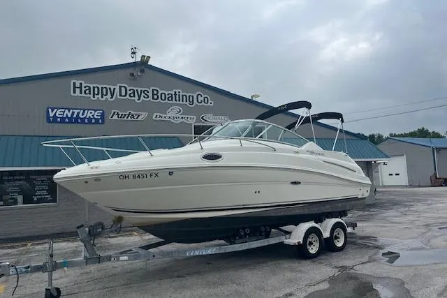 Slide: The Image of 2006 Sea Ray 240 Sundancer boat on trailer at Happy Days Boating Co. dealership. - 2