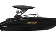 Slide: The Image of 2026 Yamaha Boats 255XD, sleek black design, side view. - 8