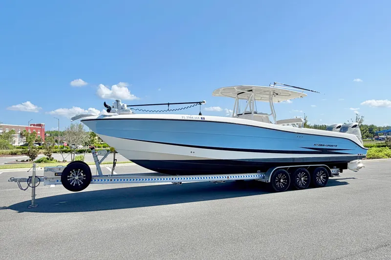 The Image of 2004 Hydra-Sports Vector 3300 CC boat on trailer under clear blue sky. - 0