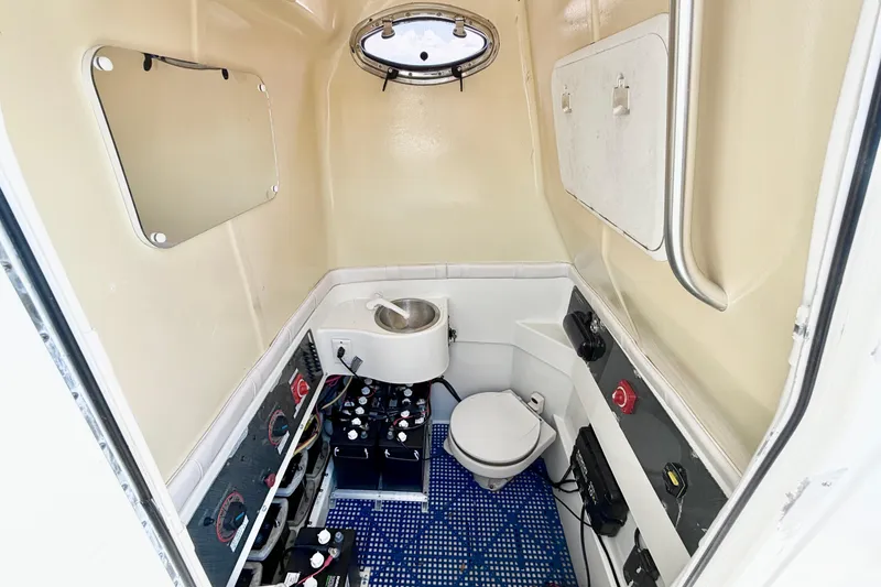 Slide: The Image of 2004 Hydra-Sports Vector 3300 CC cabin interior with toilet and sink. - 20