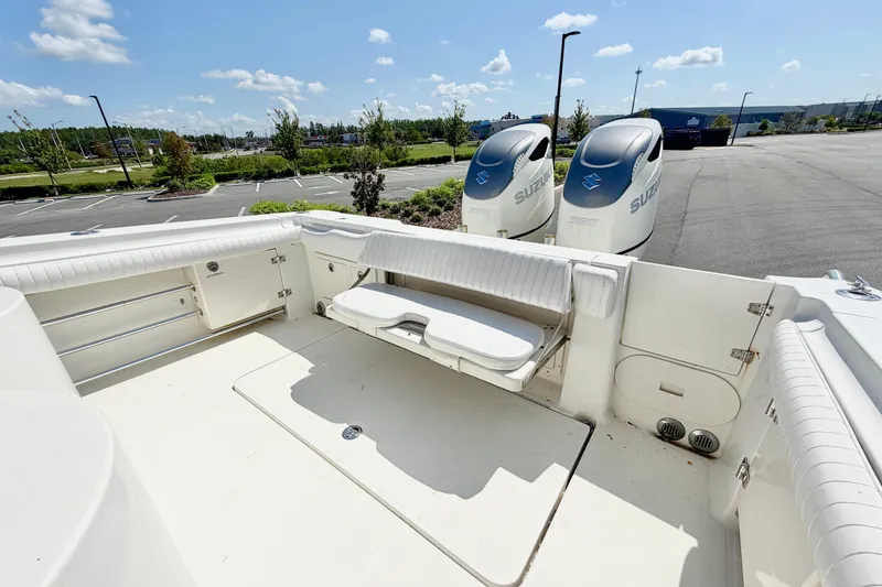 Slide: The Image of 2004 Hydra-Sports Vector 3300 CC boat with Suzuki engines in a parking lot. - 9