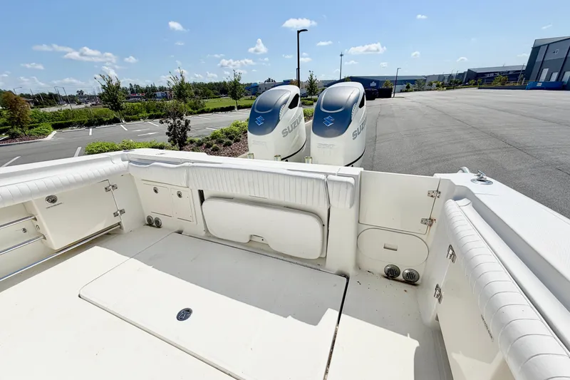 Slide: The Image of 2004 Hydra-Sports Vector 3300 CC boat with twin Suzuki outboard engines in a parking lot. - 8