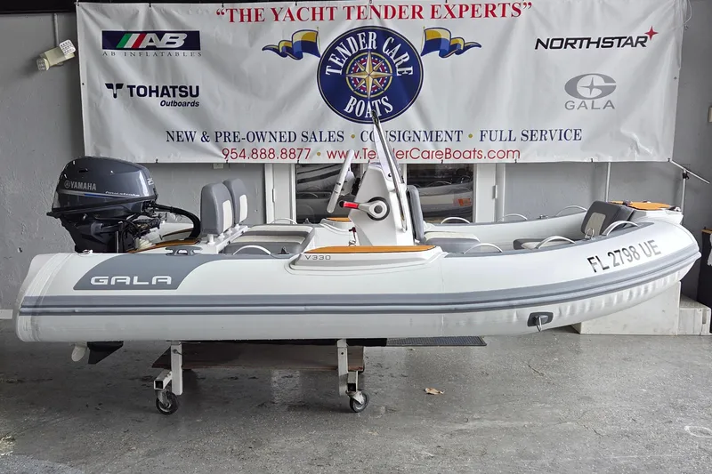 Slide: The Image of 2026 Gala Viking V330 boat with Tohatsu 30HP engine displayed at Tender Care Boats. - 2
