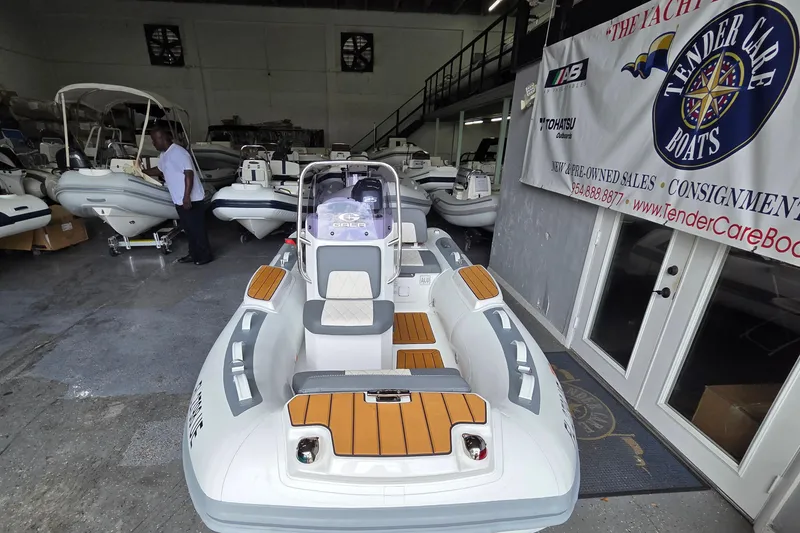 Slide: The Image of 2026 Gala Viking V330 boat with Tohatsu 30HP engine displayed in showroom. - 8