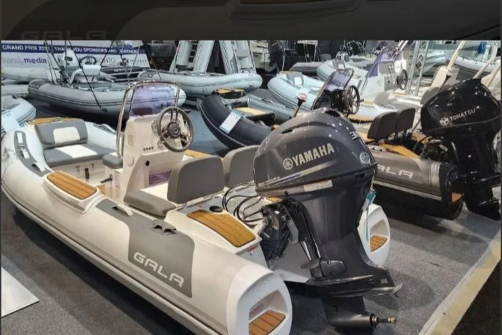 Slide: The Image of 2026 Gala VIKING V330H boat with Yamaha engine displayed at a boat show. - 10